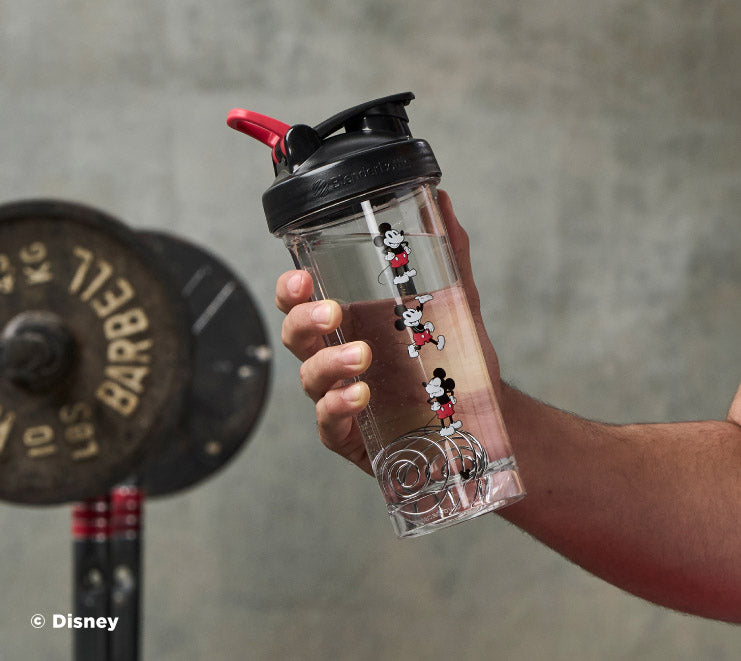 pro-series-l0 Mickey_Mouse_Protein_Shaker_Bottle_Being_Held_In_the_Gym.jpg